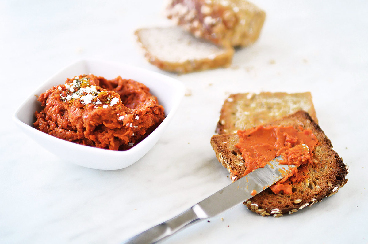 Roasted red bell pepper hummus on bread