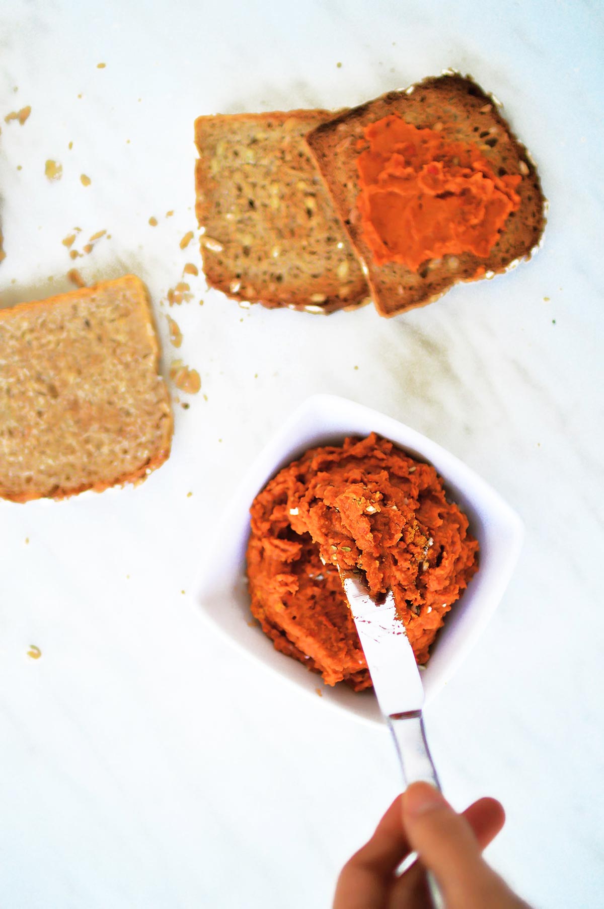 Roasted red bell pepper hummus on bread