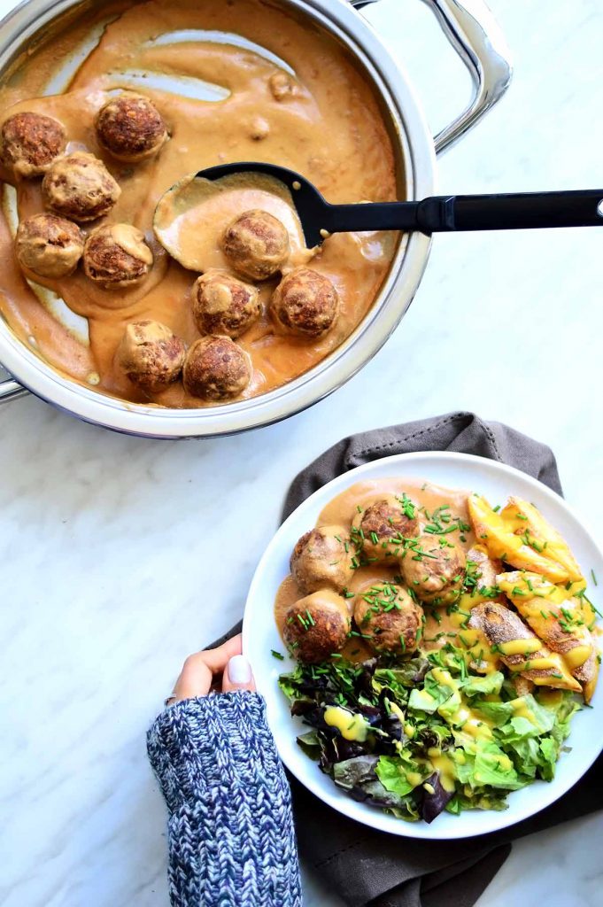 healthy vegan meatballs casserole and a plate with vegan meatballs, fries and salad
