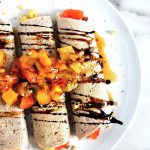gluten-free buckwheat crêpes topped with fruit and molasses