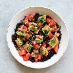 summer salad with lemon tahini dressing in a white bowl