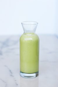 oil-free basil dressing in a glass jar