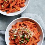 roasted pepper pasta in a white bowl